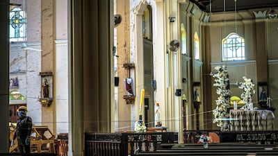 An investigator inspects the damaged interior of St Sebastian’s Church in Negombo, Sri Lanka, April 23, 2019. Jack Moore / The National.