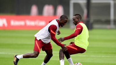 Sadio Mane and Naby Keita battle for the ball during training.