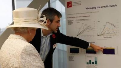Queen Elizabeth II is shown a display about contemporary issues such as the credit crunch by professor Luis Garicano during a visit to the London School of Economics. PA Archive