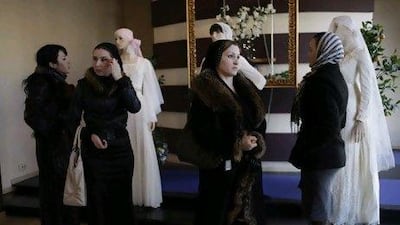 Shoppers in a Grozny boutique. There is growing pressure - sometimes violent - for women to keep their heads down... and covered. Diana Markosian