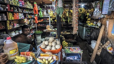 A Tamil shop owner sits behind the counter on Galle Road, Colombo, a stone's throw from the Indian Ocean. Jack Moore/The National