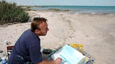 Andrew Field, an art and design teacher at British School Al Khubairat, painting at Saadiyat. Photo courtesy Andrew Field