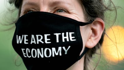 A demonstrator at the Federal Reserve building in Washington. Americans are furious about high prices, and critics blame the Fed for its initial slow response. Photo: AFP