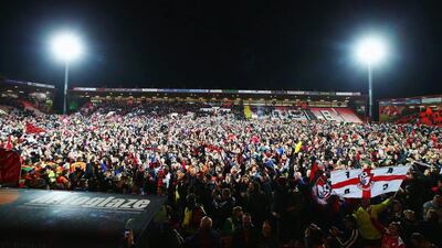 Bournemouth fans invade the pitch after the Championship win against Bolton on Monday night to ensure promotion to the Premier League. Clive Rose / Getty Images
