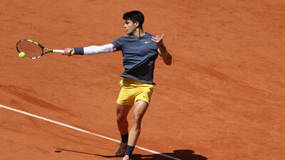 Carlos Alcaraz plays a forehand return. AFP