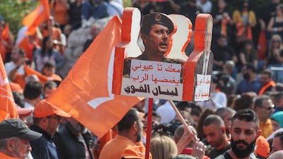 Supporters celebrate the career of Michel Aoun, Lebanon's departing president, at the presidential palace in Baabda, Lebanon. Reuters
