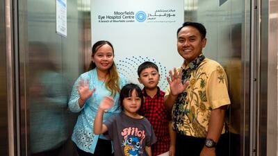 Ellyzabeth Lukitasari with her family after successfully having her eyesight restored. Photo: Moorfields