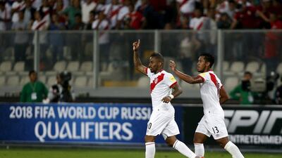 Peru's Jefferson Farfan, left, celebrates after scoring during their 2018 World Cup qualifying soccer match against Paraguay. Mariana Bazo / Reuters