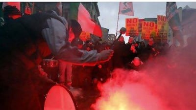 Demonstrators protest outside government buildings as the budget is announced in Dublin yesterday.