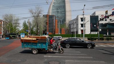 A handful of vehicles hit the road in Beijing as the city authorities tightened Covid controls. EPA