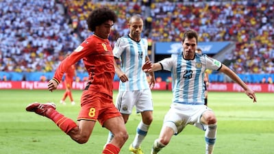 Marouane Fellaini of Belgium controls the ball against Jose Maria Basanta of Argentina during their match on Saturday at the 2014 World Cup in Brasilia, Brazil. Matthias Hangst / Getty Images