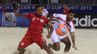 Tahiti's Patrick Tepa, left,challenges, the UAE's Haithan Al Kaabi during the Emirate's 3-2 defeat at the Beach Soccer World Cup. Gregory Boissy / AFP Photo
