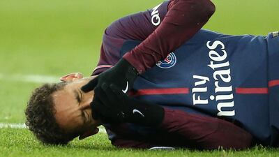 Paris Saint-Germain’s Neymar lies on the pitch after sustaining an injury in the 3-0 win over Marseille. Stephane Mahe / Reuters