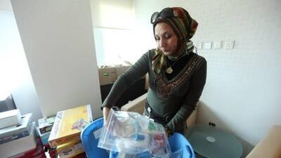 Abeer Gibril, the Science Express project coordinator, with some of the kits the Emirates Foundation hopes will make learning fun.