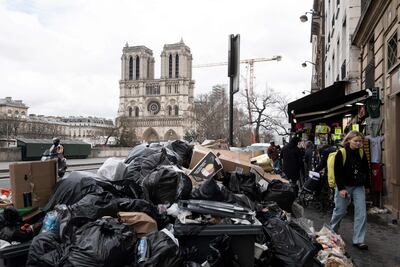 Mounds of household waste litter the pavements near Notre-Dame cathedral on Monday. AFP