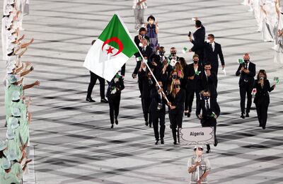 Flag bearers of Algeria Amel Melih and Mohamed Flissi. EPA