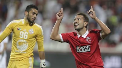 Everton Ribero celebrates his goal on debut for Al Ahli after coming off the bench to lead his new team to victory over Sharjah. Hasan Alraesi / Al Ittihad