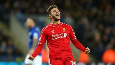 Adam Lallana of Liverpool celebrates after scoring an early equaliser in his side's eventual 3-1 win over Leicester City on Tuesday. Clive Mason / Getty Images