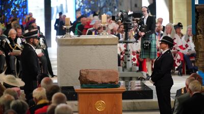 Officers guard the Stone of Destiny at St Giles' Cathedral. PA