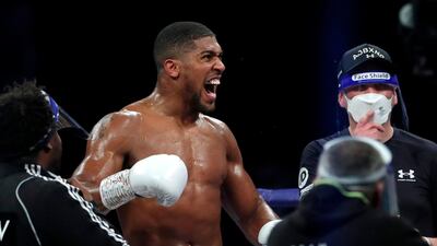 Anthony Joshua celebrates his victory.