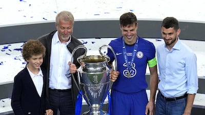 Chelsea owner Roman Abramovich poses with club captain Cesar Azpilicueta and the Ueefa Champions League trophy following Chelsea's win over Manchester City in the final. PA
