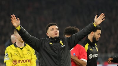 Jadon Sancho celebrates after Borussia Dortmund's Champions League last-16 win over PSV Eindhoven on March 13, 2024. EPA