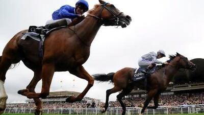 Jockey Richard Hughes rides Toronado, right, to a win over Dawn Approach in the Sussex Stakes at Glorious Goodwood on Wednesday. Alan Crowhurst / Getty Images
