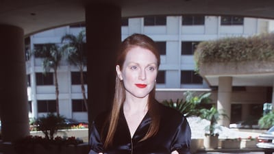 Julianne Moore, in a button-front midi, attends the Academy Awards luncheon for Oscar nominees on March 13, 2000 in Los Angeles, California. Getty Images