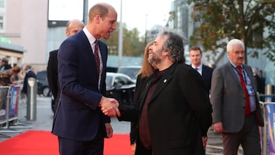 Britain's Prince William, Duke of Cambridge shakes hands with New Zealand film maker Peter Jackson as he attends the world premiere of Peter Jackson's film 'They Shall Not Grow Old' during the BFI London Film Festival in London Reuters