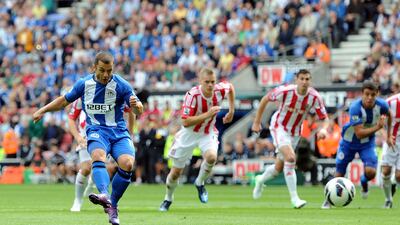 Wigan's Shaun Maloney scores the opening goal from the penalty spot during the Premier League match against Stoke City. Chris Brunskill/Getty Images