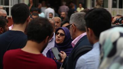 Huda Kaya, a HDP Member of Parliament standing for re-election, speaks to the press after casting her vote on Monday in Tarlabasi, a predominantly Kurdish neighbourhood of Istanbul. Pesha Magid / The National