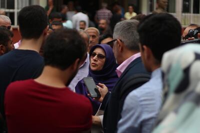 Huda Kaya, a HDP Member of Parliament standing for re-election, speaks to the press after casting her vote on Monday in Tarlabasi, a predominantly Kurdish neighbourhood of Istanbul. Pesha Magid / The National