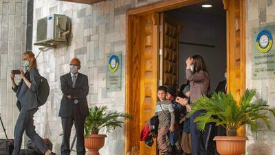 Children leave a building in Qamishli, north-east Syria, during the repatriation of orphans of suspected ISIS fighters by Syrian Kurdish officials. The children were taken into the care of a Russian delegation. AFP
