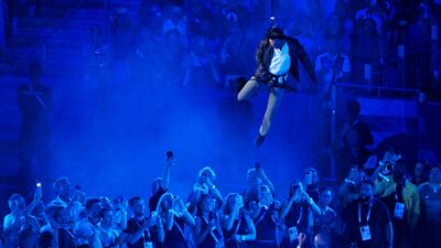 Tom Cruise is lowered from the roof of Stade de France during the Closing Ceremony. Getty Images
