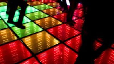 Dancers at club WATT in Rotterdam produce the energy for the lights of the dance floor as they stomp their feet. WATT is one of a number of venues around the world embracing the concept of green clubbing.