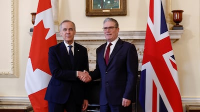 Canadian Prime Minister Mark Carney shakes hands with Mr Starmer at 10 Downing Street in March. Getty Images