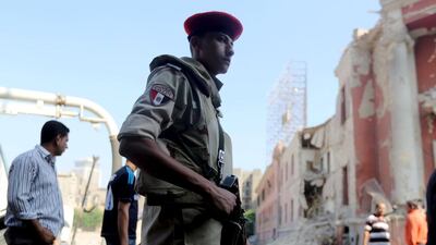 Egyptian security officials inspect the site of a bomb blast at the Italian consulate in Cairo, Egypt, on July 11, 2015. Mohamed Abd El Ghany/Reuters