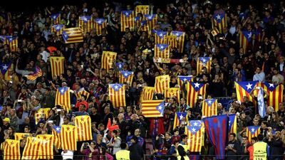 Barcelona fans show ‘esteladas’ the Catalonia flag, and a symbol of the Catalan independence movement. Alberto Estevez / EPA