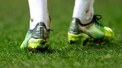 Manchester City's Oleksandr Zinchenko displays the Ukraine flag on his boots. Reuters