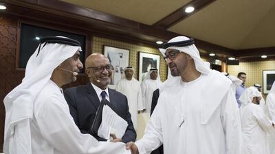 Sheikh Mohammed bin Zayed, right, with Abdullah Al Ghufli, drector, UAE Pakistan Assistance Program, after the panel discussion. With them is Dr Elias Durray, World Health Organisation emergency coordinator, back centre. Ryan Carter / Crown Prince Court - Abu Dhabi