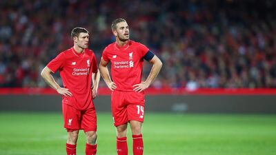 James Milner, left, talks to Jordan Henderson during an international friendly between Adelaide United and Liverpool at Adelaide Oval on July 20, 2015. Henderson says only consistency is holding Liverpool at the moment and they have proven they can beat the big clubs. Matt King / Getty Images