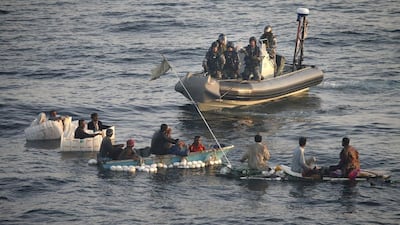 A photo taken on March 1, 2014 shows crew from the Australian warship HMAS Darwin rescue 13 Iranian fisherman shipwrecked off Pakistan. Abis Sarah Williams / Australian department of defence / AFP Photo