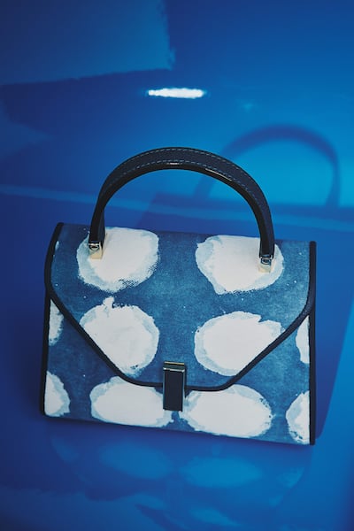 The Iside Indigo, part of Valextra’s Journey of Craftsmanship, sees Japanese artist Riku Matsuzaki apply traditional indigo dyeing to the house’s signature silhouette. Photo: Valextra