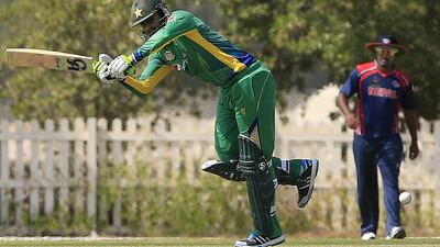 Pakistan’s Shoaib Malik strikes during an international friendly match against Nepal at Academy Oval grounds at Zayed Cricket Stadium in Abu Dhabi. Ravindranath K / The National