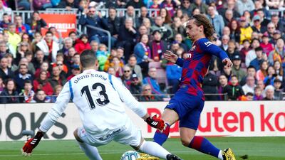 Barcelona's Antoine Griezmann scores against Getafe on Saturday. EPA