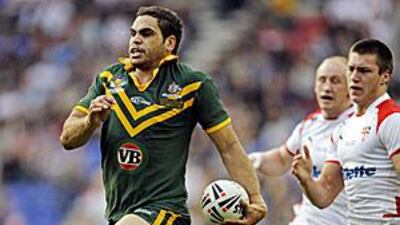 Australia's Greg Inglis breaks through the England defence on his way to scoring in the Four Nations tournament in October.