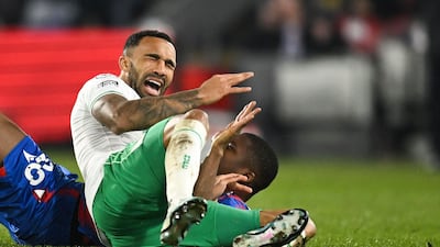 Newcastle striker Callum Wilson is tackled by Crystal Palace's Malian midfielder Cheick Doucoure. AFP