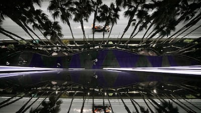 McLaren Formula One driver Oscar Piastri, from Australia, is reflected in a window during a practice session for the Las Vegas Grand Prix. AP Photo