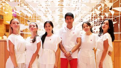 Left to Right - Maria Sukova, Valeriia Kukuman, Busazhida Kasymbekova, Tolibjon Khamrayev, Renata Kokeyeva and Viktoriia Myroshnychenko at the Poland Pavilion at the world's fair.