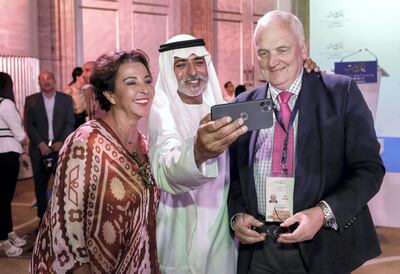 His Excellency Sheikh Nahayan Mabarak Al Nahayan takes a selfie with Ms Raghida Dergham and Nik Gowing. Victor Besa for The National